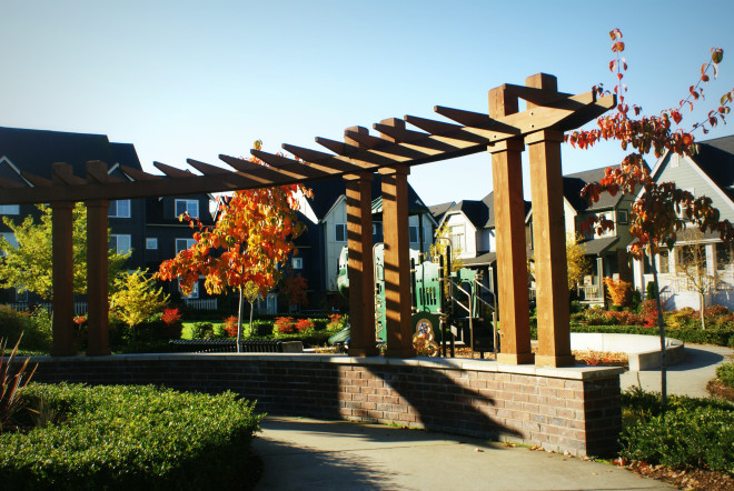 Brick Wall Separates Play Area from Walkway