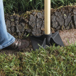 Retaining wall installation base tamping
