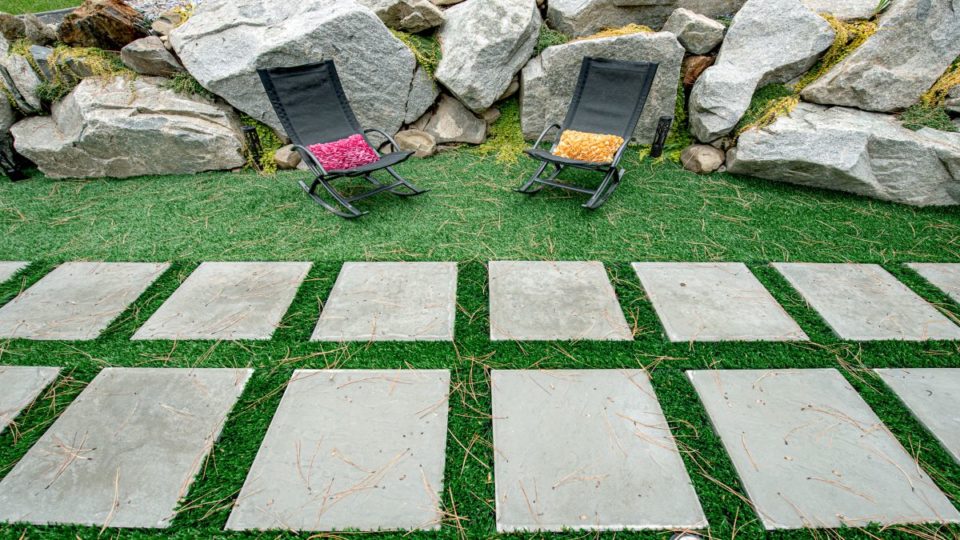 Columbia Slate patio slabs set in artificial turf