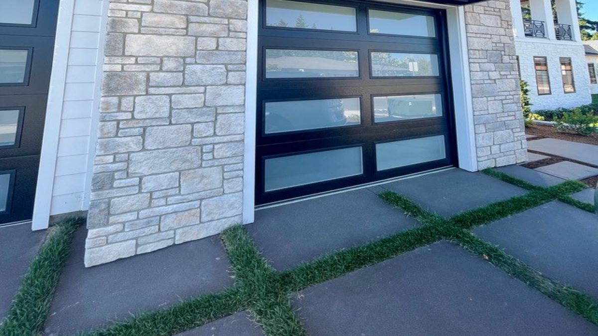 Artificial turf driveway with charcoal Vancouver Bay architectural slabs