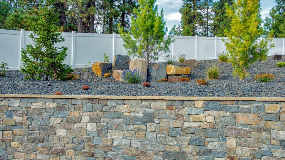 An outdoor wall faced with natural stone thin veneer