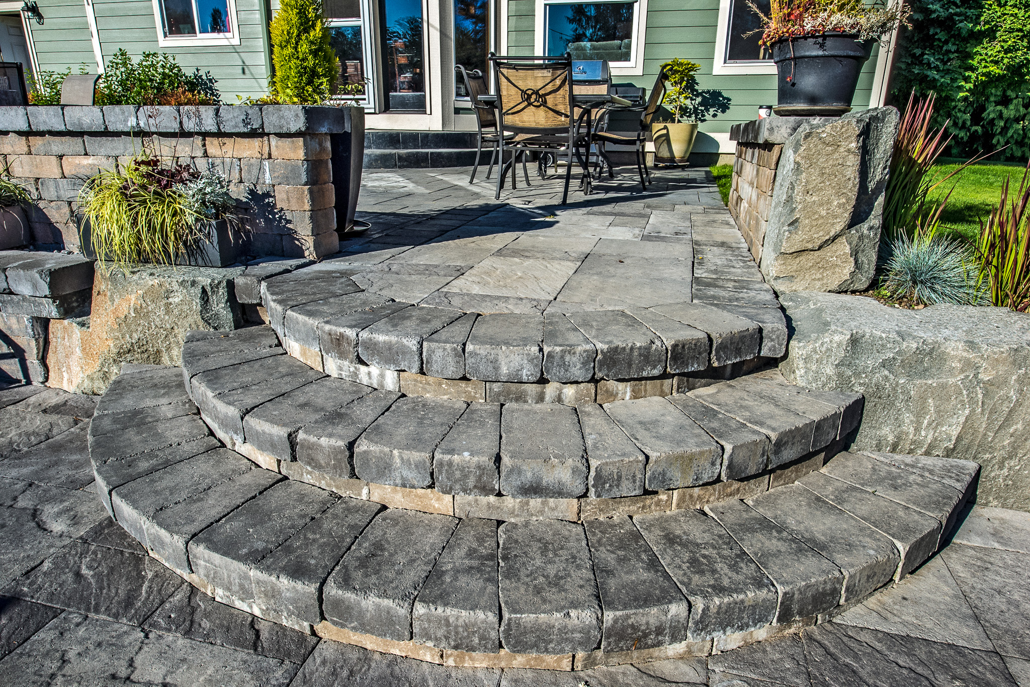 TuscanStone stairs leading up to a Columbia Slate paver patio
