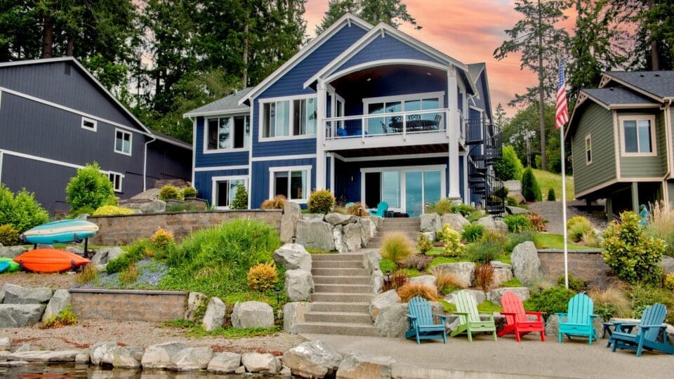 Lakefront home with landscaping and retaining wall terraces