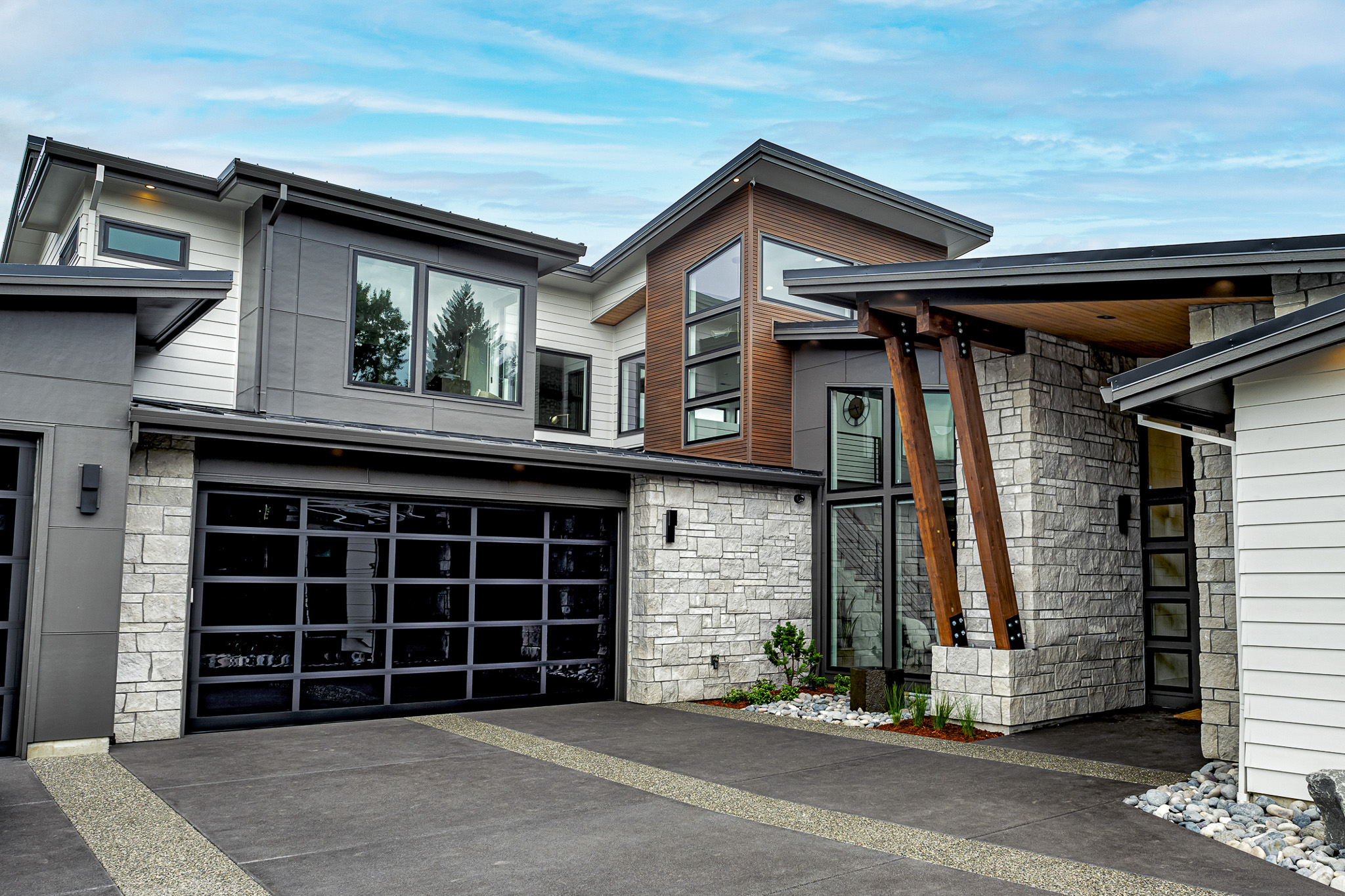 Modern custom home with a veneer of white natural stone