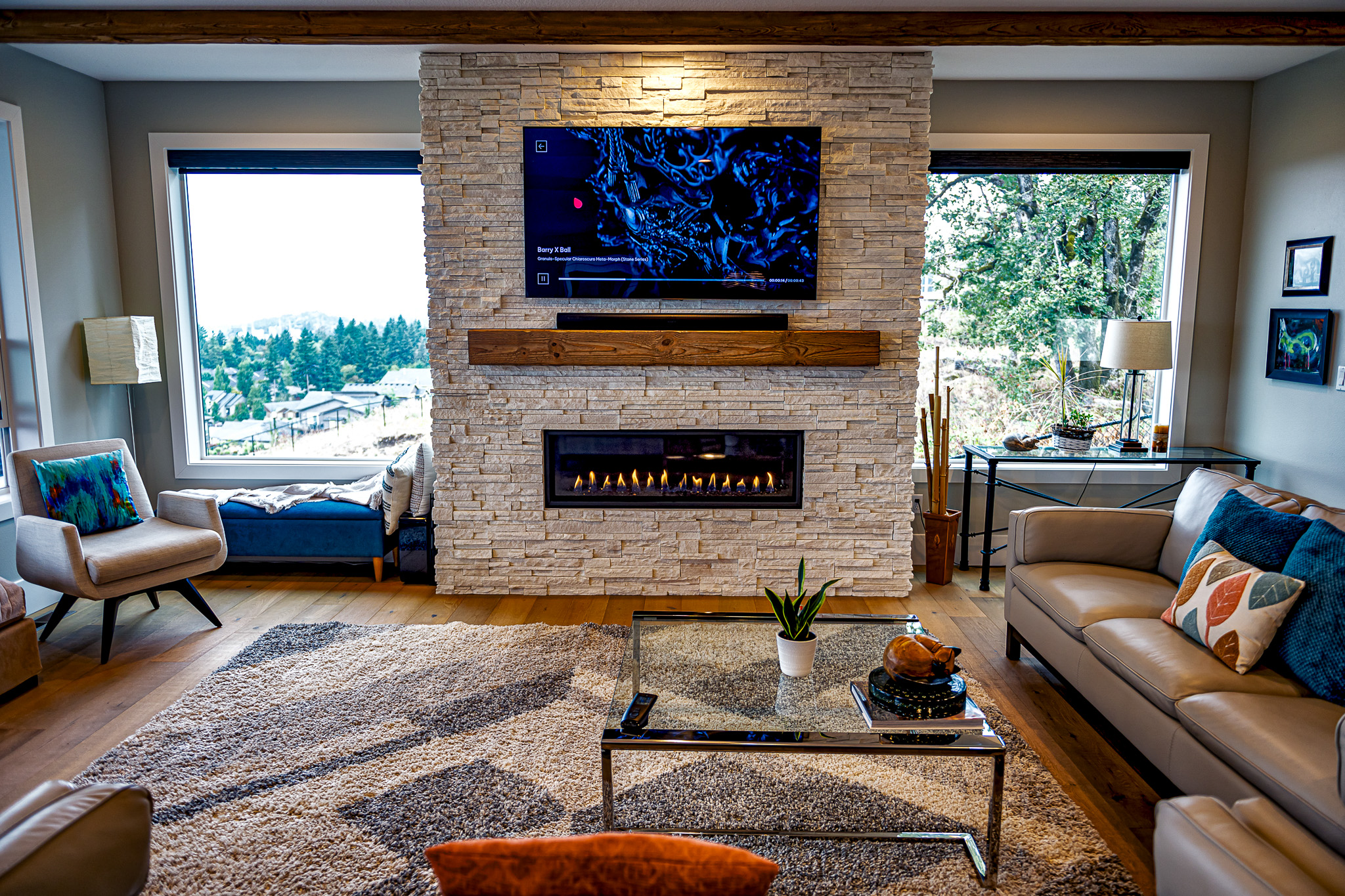 White ledgestone from Cultured Stone faces a modern indoor fireplace