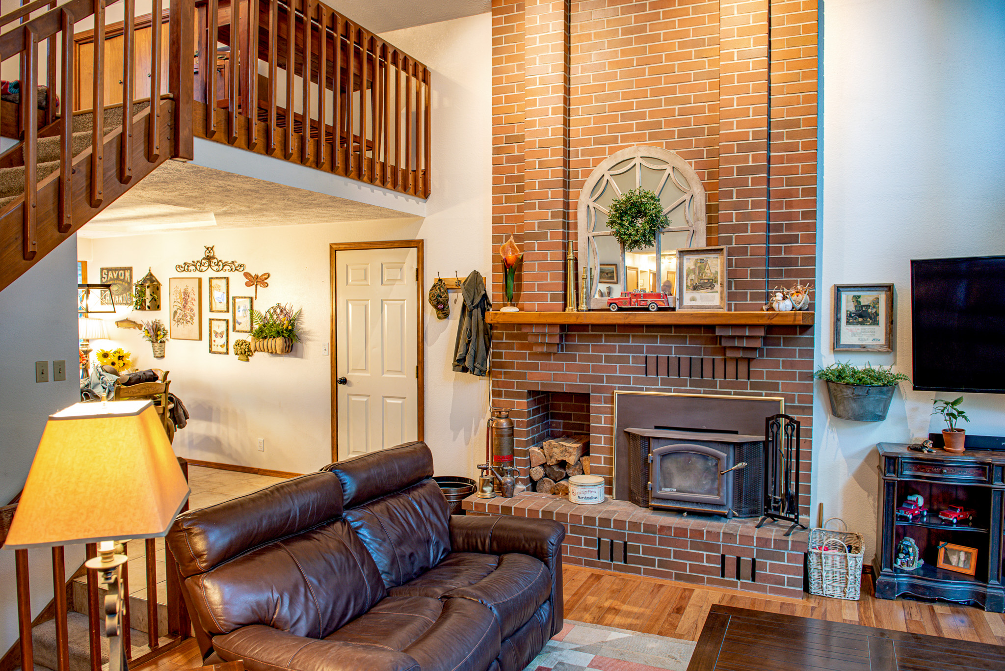 Red brick faces a modern indoor fireplace