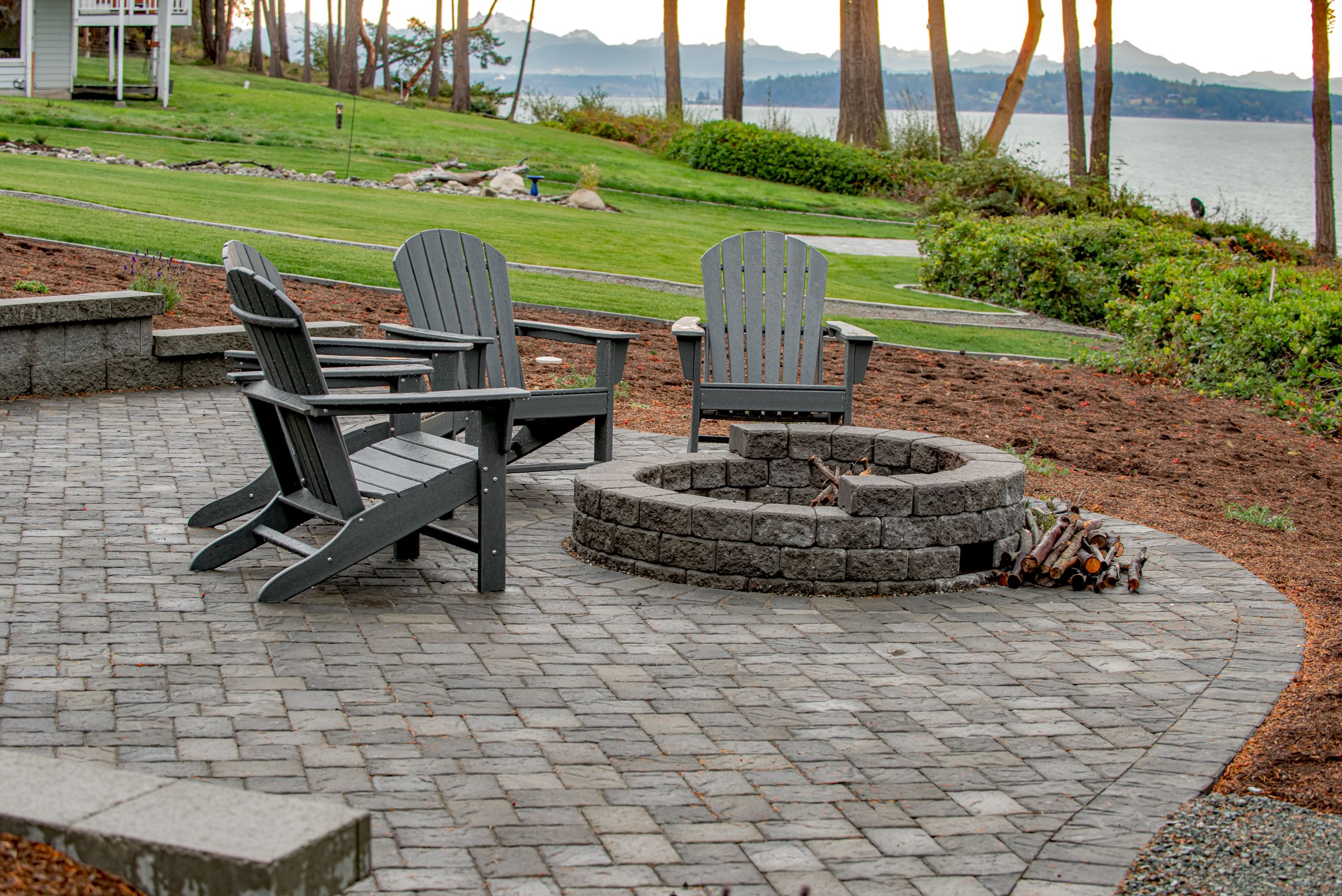 Circular patio with fire pit created with retaining wall blocks