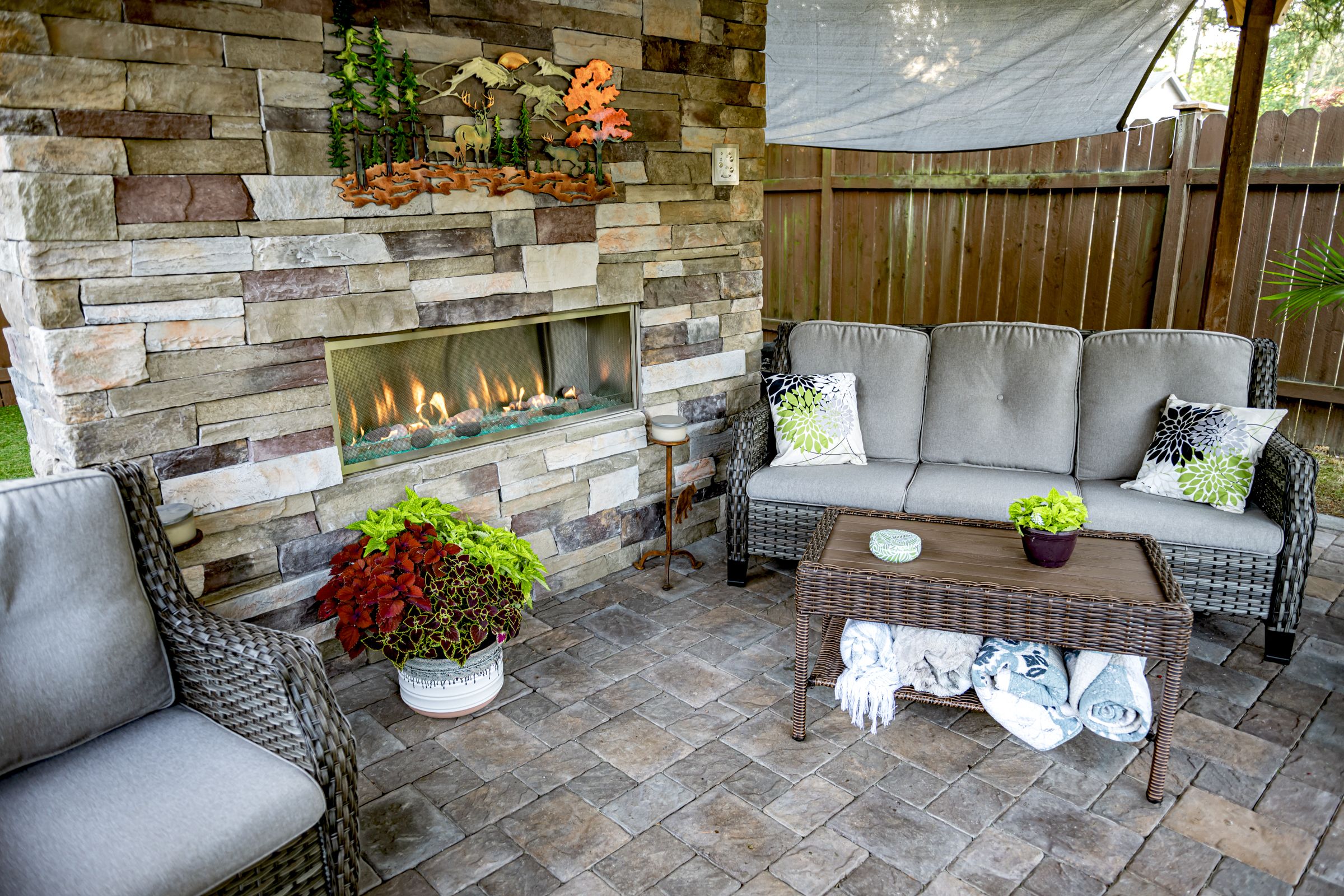 Outdoor living space with fireplace faced with Cultured Stone