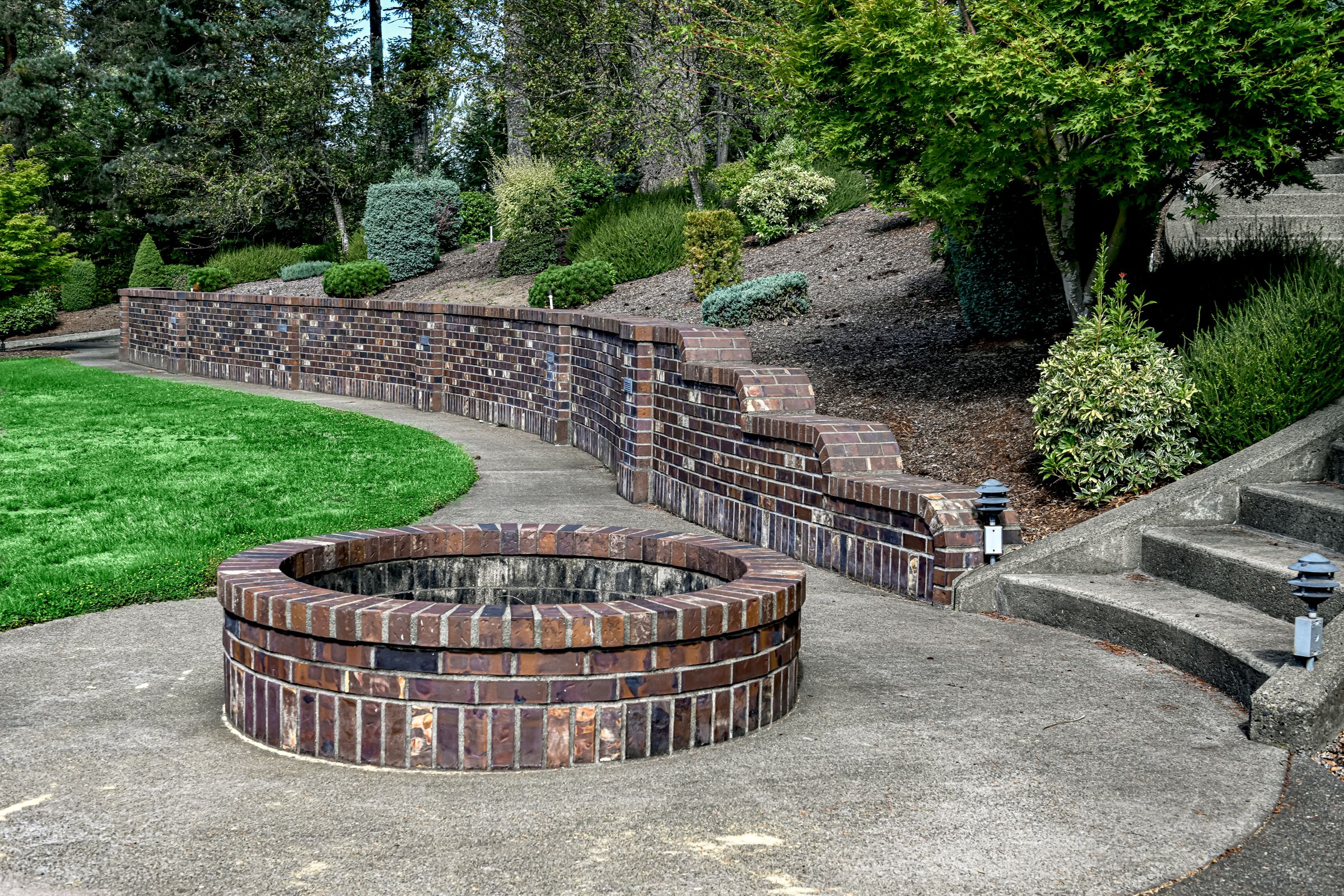 Fire pit constructed with dimpled brown face brick