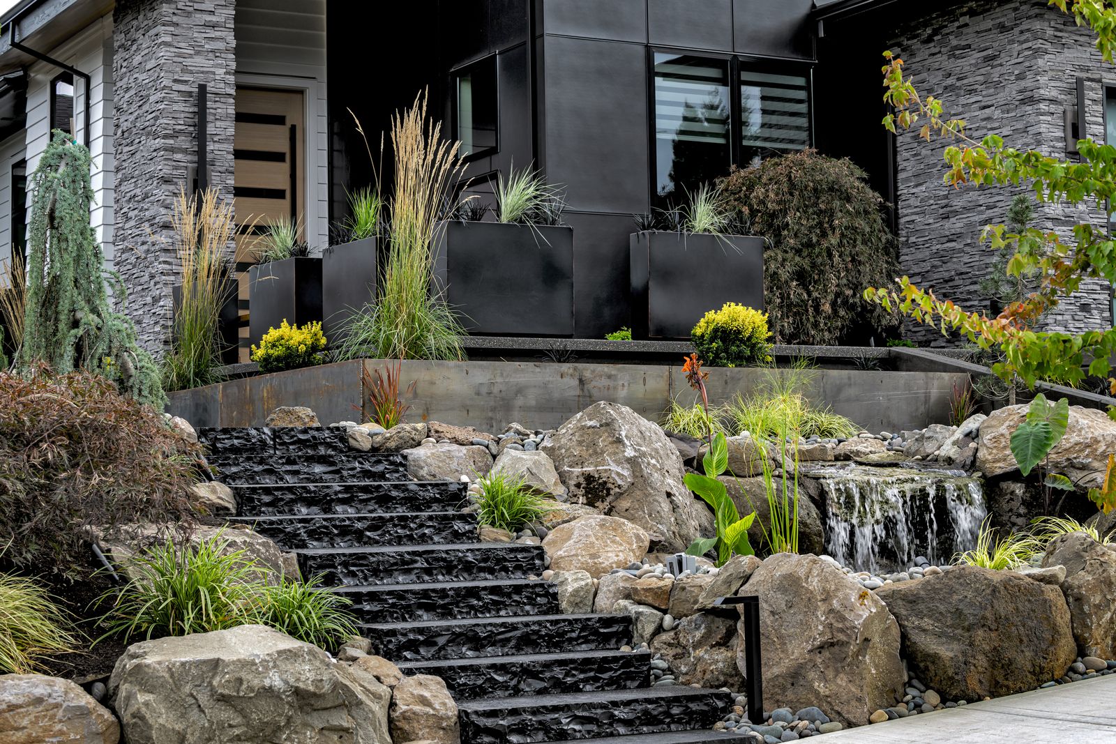 Modern home with black limestone stair treads