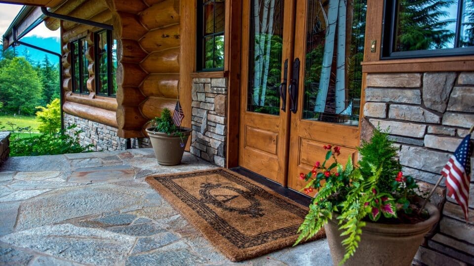 Log home with a flagstone entryway
